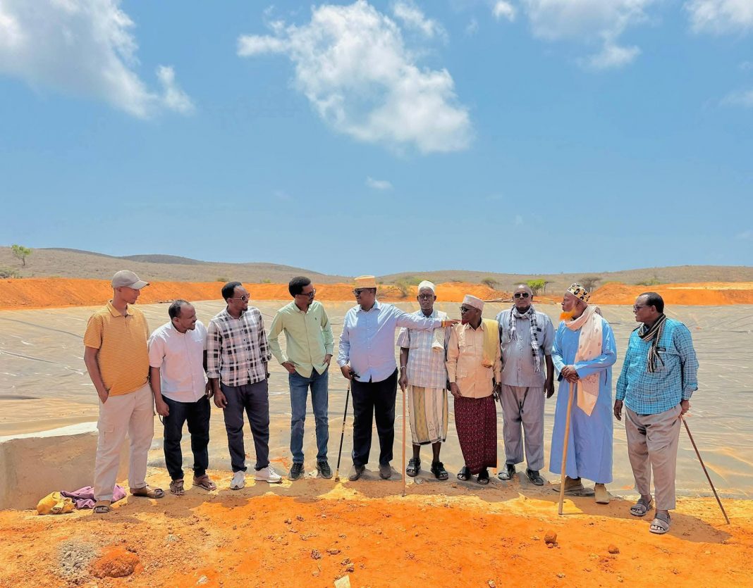 Director of aviation in Jubaland ministry of transport visits Afmadow with WFP team to assess key road infrastructure